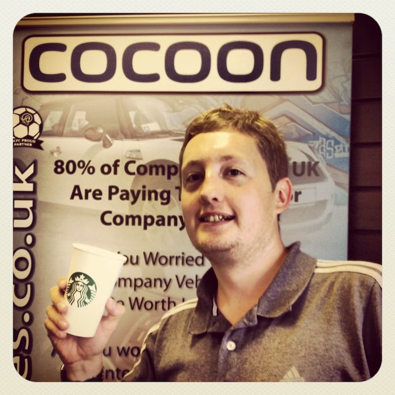 Rhys Adams infront of Cocoon Pullup Banner